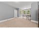 Spacious office with neutral walls, carpet and natural light at 6840 Early Jersey Rd, Meggett, SC 29449