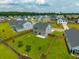 Aerial view of a spacious backyard with lush green grass and privacy fence at 716 Mcroy St, Moncks Corner, SC 29461