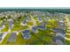 Aerial view of a neighborhood with manicured lawns and winding streets at 716 Mcroy St, Moncks Corner, SC 29461