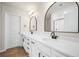 Bathroom featuring a double vanity with a quartz countertop, modern fixtures, and framed mirrors at 716 Mcroy St, Moncks Corner, SC 29461