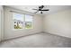 Bright bedroom with large window overlooking the yard, ceiling fan, and plush carpeting at 716 Mcroy St, Moncks Corner, SC 29461