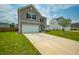 Charming two-story home featuring a two-car garage and well-manicured front lawn at 716 Mcroy St, Moncks Corner, SC 29461