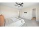 Bright main bedroom with neutral decor, a ceiling fan, and carpeted floors; pre-wired for wall mounted TV at 716 Mcroy St, Moncks Corner, SC 29461