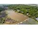 Picturesque aerial view of waterfront homes nestled in a lush, wooded landscape at 8964 Palmetto Rd, Edisto Island, SC 29438