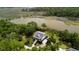 Beautiful aerial view of the home and waterfront landscape surrounded by lush green trees at 8964 Palmetto Rd, Edisto Island, SC 29438