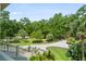 Exterior view from porch looking out at the circular driveway and lush landscaping at 8964 Palmetto Rd, Edisto Island, SC 29438
