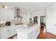 Modern kitchen with granite countertops, stainless steel appliances, and hardwood floors at 8964 Palmetto Rd, Edisto Island, SC 29438
