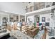 Spacious living area with open floor plan to the kitchen, high ceilings, and a cozy atmosphere at 8964 Palmetto Rd, Edisto Island, SC 29438