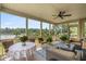 Inviting screened porch offering scenic waterfront views and comfortable wicker furniture at 8964 Palmetto Rd, Edisto Island, SC 29438