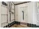 Outdoor shower featuring white walls and wood flooring at 8964 Palmetto Rd, Edisto Island, SC 29438