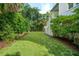 Expansive backyard with lush green lawn and mature trees at 924 Mciver St, Mount Pleasant, SC 29464