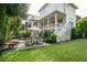 Beautiful backyard with pool, lawn, outdoor seating, and covered porch of the home at 924 Mciver St, Mount Pleasant, SC 29464