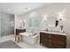 Bright bathroom with dual vanities, a soaking tub, and a glass-enclosed shower at 924 Mciver St, Mount Pleasant, SC 29464