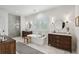 Spacious bathroom featuring dual vanities, soaking tub, and glass-enclosed shower at 924 Mciver St, Mount Pleasant, SC 29464
