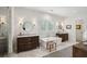 Elegant bathroom with dual vanities, soaking tub, and marble countertops at 924 Mciver St, Mount Pleasant, SC 29464