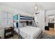 Charming bedroom with a bunk bed, white walls, and light wood floors provides a cozy space at 924 Mciver St, Mount Pleasant, SC 29464