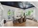Light and airy dining area with stylish lighting and a view to the lanai at 924 Mciver St, Mount Pleasant, SC 29464