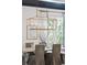 Elegant dining room with statement lighting fixture and neutral tones at 924 Mciver St, Mount Pleasant, SC 29464