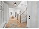 Welcoming foyer with hardwood floors, staircase, and an open view to the living room at 924 Mciver St, Mount Pleasant, SC 29464