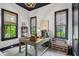 Cozy home office with rustic desk, ample natural light, and unique decor at 924 Mciver St, Mount Pleasant, SC 29464
