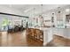 Modern kitchen with a large island, stainless steel appliances, and dining area at 924 Mciver St, Mount Pleasant, SC 29464