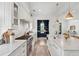 Bright, spacious kitchen featuring white cabinets, marble countertops, and stainless-steel appliances at 924 Mciver St, Mount Pleasant, SC 29464