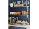 Detail of kitchen shelving with coffee and bar area on marble counters at 924 Mciver St, Mount Pleasant, SC 29464