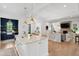 Open-concept kitchen flowing into a living area, featuring a large island and stylish decor at 924 Mciver St, Mount Pleasant, SC 29464