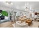 Cozy indoor/outdoor space with a bar area leading to an outdoor kitchen and pool at 924 Mciver St, Mount Pleasant, SC 29464
