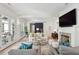 Cozy living room with a brick fireplace, TV, and a barn door accent at 924 Mciver St, Mount Pleasant, SC 29464