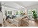 Bright living room with hardwood floors, comfortable seating, and access to the porch at 924 Mciver St, Mount Pleasant, SC 29464