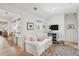 Bright living area with white sofa, wood floors, and a large window with natural lighting at 924 Mciver St, Mount Pleasant, SC 29464