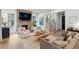 Cozy living room with a brick fireplace, hardwood floors, and a staircase at 924 Mciver St, Mount Pleasant, SC 29464