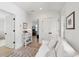 Light-filled living space with neutral decor, hardwood floors, and access to other rooms at 924 Mciver St, Mount Pleasant, SC 29464