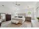 Spacious main bedroom with vaulted ceiling, hardwood floors, and ample natural light from two windows at 924 Mciver St, Mount Pleasant, SC 29464