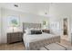 Comfortable main bedroom featuring a luxurious upholstered bed and neutral decor at 924 Mciver St, Mount Pleasant, SC 29464