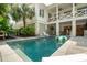 The refreshing pool features a vibrant float and an inviting sundeck surrounded by beautiful tropical landscaping at 924 Mciver St, Mount Pleasant, SC 29464