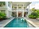 Exterior view of the home showcasing the private pool, sundeck, and covered outdoor living area at 924 Mciver St, Mount Pleasant, SC 29464