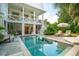 The luxurious backyard features a private pool, sundeck, and outdoor kitchen, perfect for entertaining at 924 Mciver St, Mount Pleasant, SC 29464