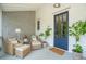 Cozy front porch with wicker chairs, a side table, and a blue front door at 924 Mciver St, Mount Pleasant, SC 29464