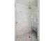 Modern glass-enclosed shower with marble tile and a built-in bench at 924 Mciver St, Mount Pleasant, SC 29464