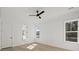 Bright bedroom with hardwood floors, two windows for natural light, and a modern ceiling fan at 100 E Carolina Ave, Summerville, SC 29483