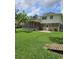Expansive backyard with a screened porch, wooden walk-way, and mature trees at 101 Brittany Ct, Summerville, SC 29485
