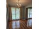 Dining area featuring hardwood floors, natural light, and a decorative chandelier at 101 Brittany Ct, Summerville, SC 29485