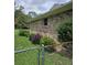 Brick exterior with well-maintained landscaping and partial fencing for added privacy at 101 Brittany Ct, Summerville, SC 29485