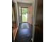 Entryway features black tile flooring, view of the front yard, and a pink front door at 101 Brittany Ct, Summerville, SC 29485