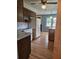 Kitchen features hardwood floors, white appliances, and wood cabinets at 101 Brittany Ct, Summerville, SC 29485