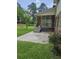 Screened porch with outdoor seating area, accessible from the backyard at 101 Brittany Ct, Summerville, SC 29485
