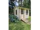 Backyard shed offers extra storage with convenient access ramp and hydrangea accents at 101 Brittany Ct, Summerville, SC 29485