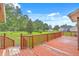 A spacious wooden back deck overlooks the backyard at 1023 Striper Ave, Moncks Corner, SC 29461